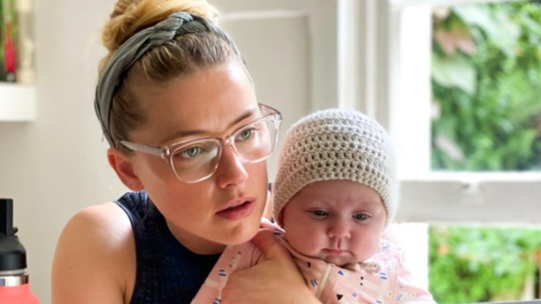 Amber Heard holding Oonagh