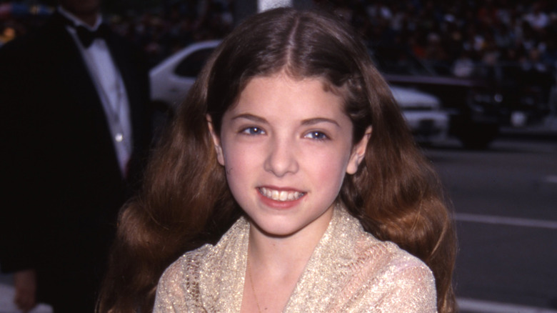 Young Anna Kendrick smiles