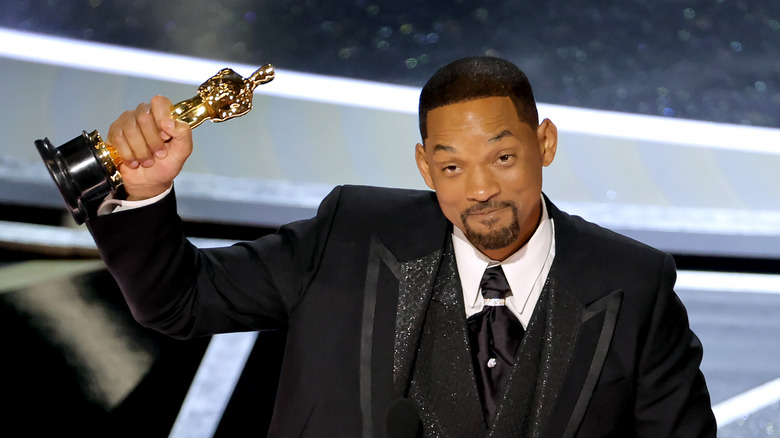 Will Smith holding his Oscar