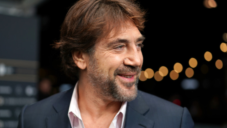 Javier Bardem looks left