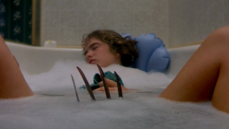 Nancy in bathtub with Freddy's claw