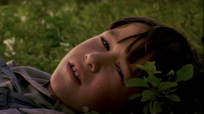 Joseph Gordon-Levitt lying in grass