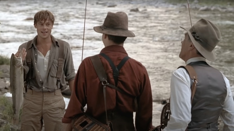 Brad Pitt holds fish