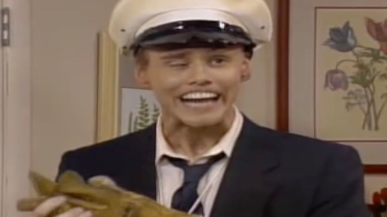 Jim Carrey grinning uncomfortably 