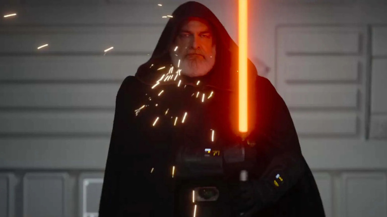 Baylan Skoll wields a reddish-orange lightsaber