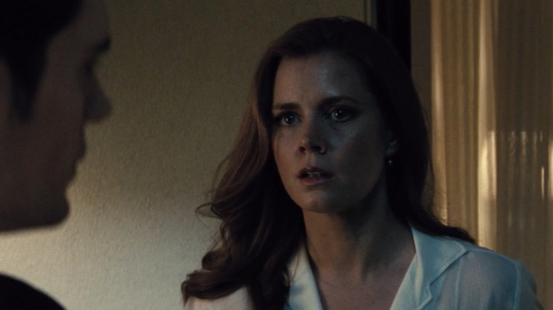 Amy Adams listening to Henry Cavill intently