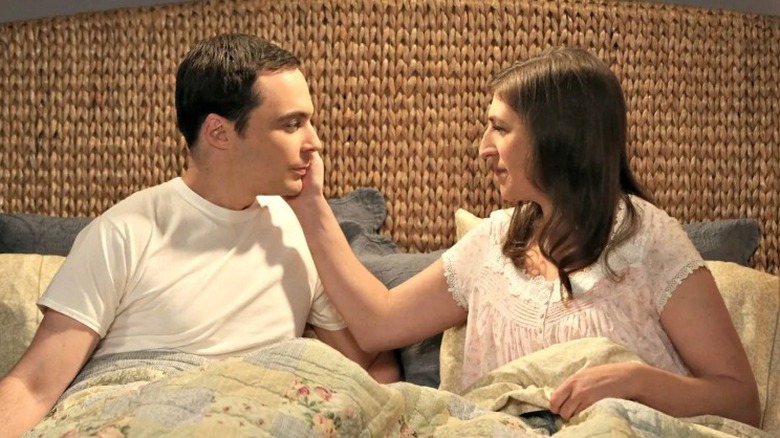 Amy touches Sheldon's face