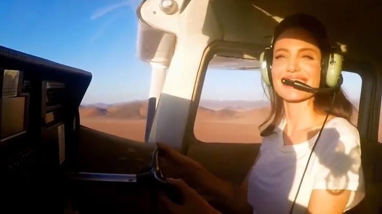 Angelina Jolie flying an airplane 