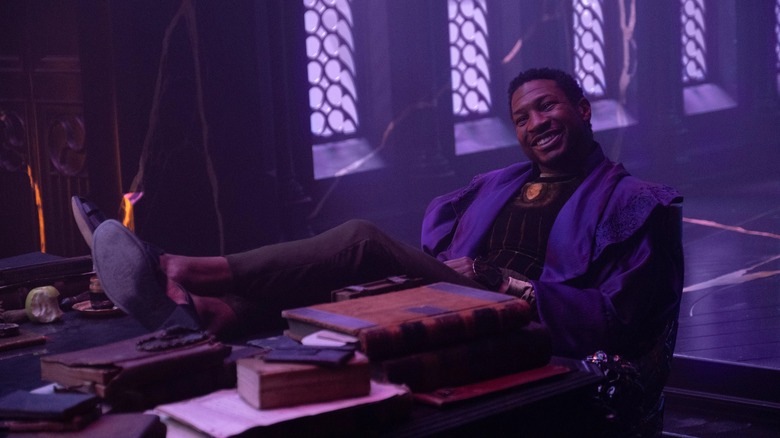 Jonathan Majors relaxing in a chair