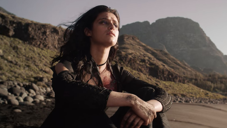 Yennefer sitting on beach