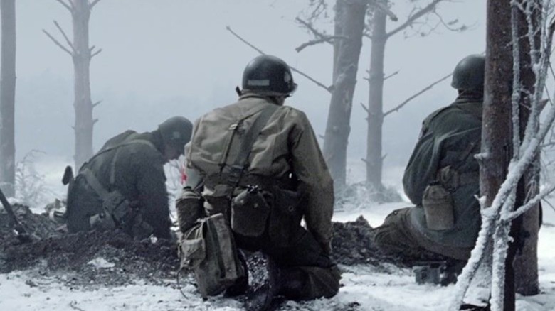 Easy Company sitting in the snow