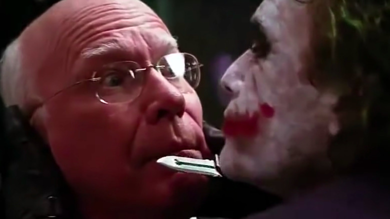 The Joker holds a knife to Senator Patrick Leahy's mouth