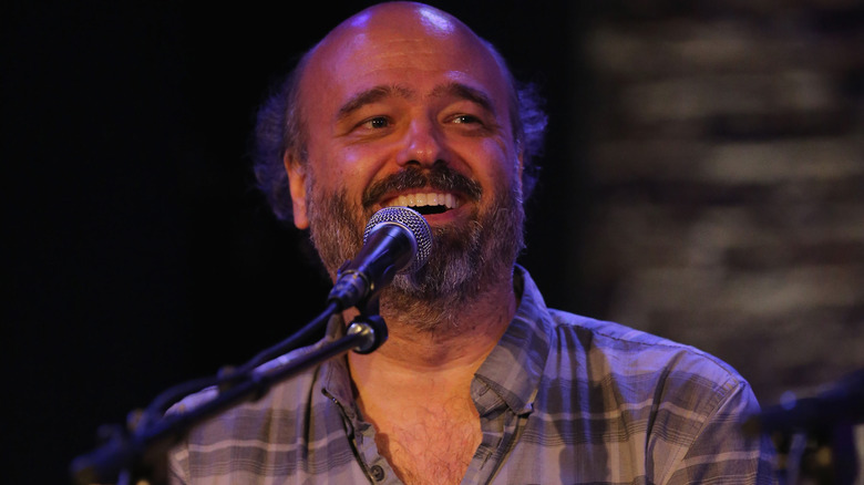 Scott Adsit laughing with a crowd