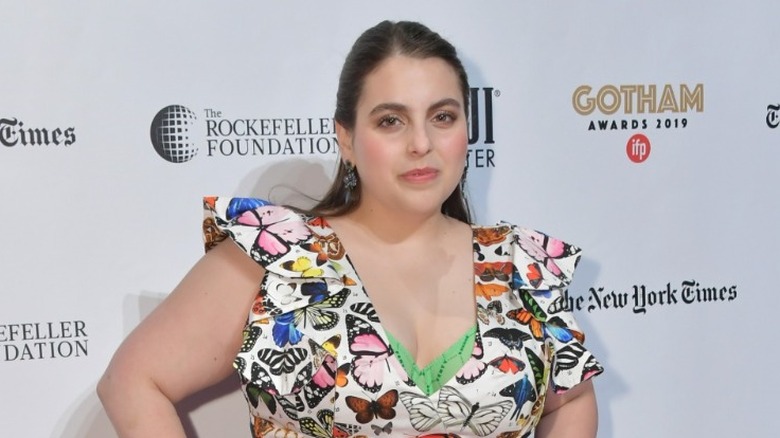 Beanie Feldstein posing on a red carpet