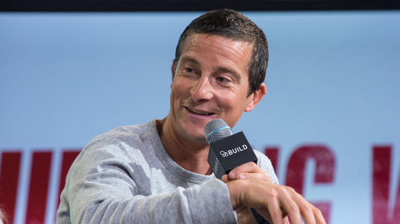 Bear Grylls with a microphone