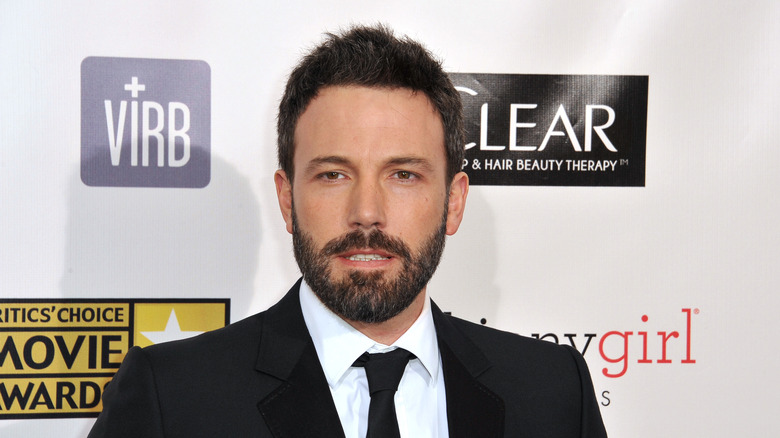 Bearded Ben Affleck wearing a suit