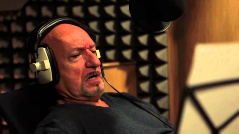 Ben Kingsley reclining in booth