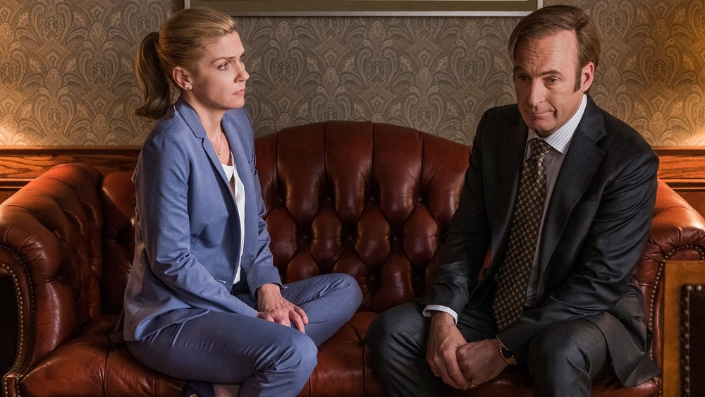 Kim and Jimmy seated on a couch in Better Call Saul