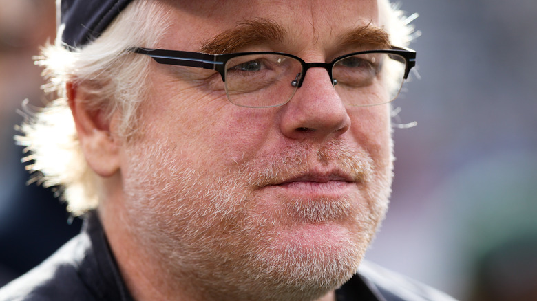 Philip Seymour Hoffman watches a game