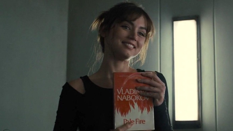 Joi holding Pale Fire
