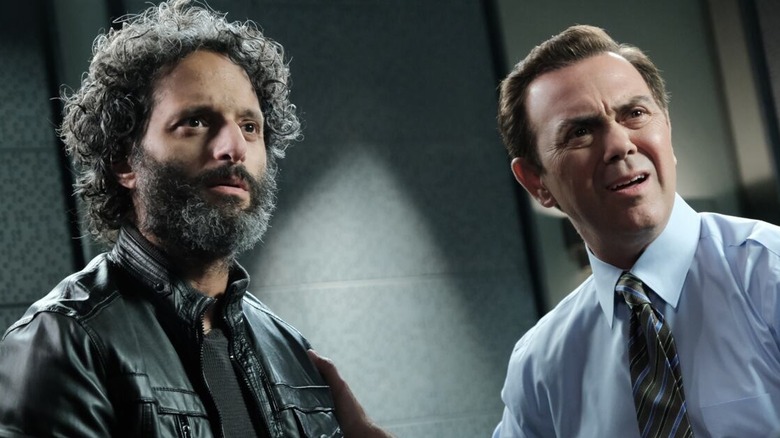 Jason Mantzoukas and Joe Truglio look up concerned