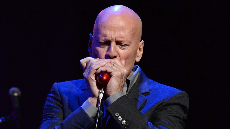 Willis playing harmonica