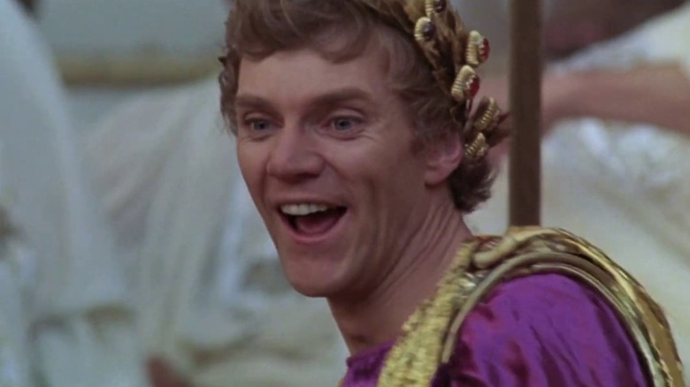 Caligula laughing with sadistic glee