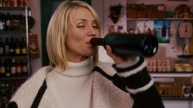 Diaz drinks wine as Amanda in The Holiday