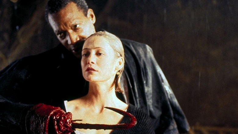 Tony Todd holds a woman hostage