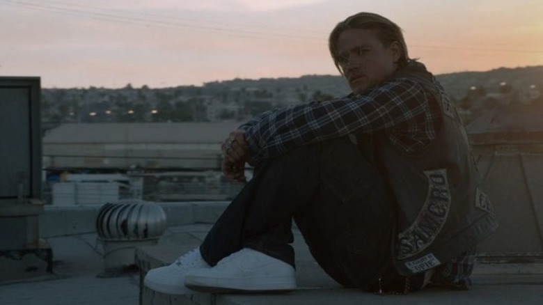 Jax Teller sitting on rooftop