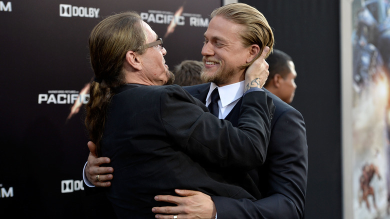 Kurt Sutter embracing Charlie Hunnam