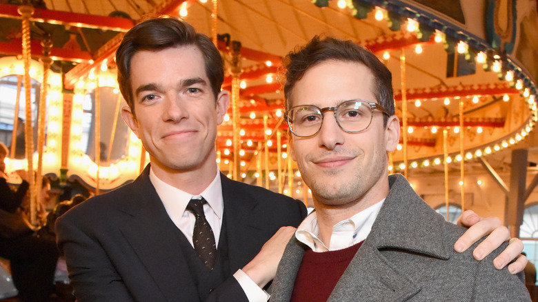 Andy Samberg and John Mulaney, both smiling