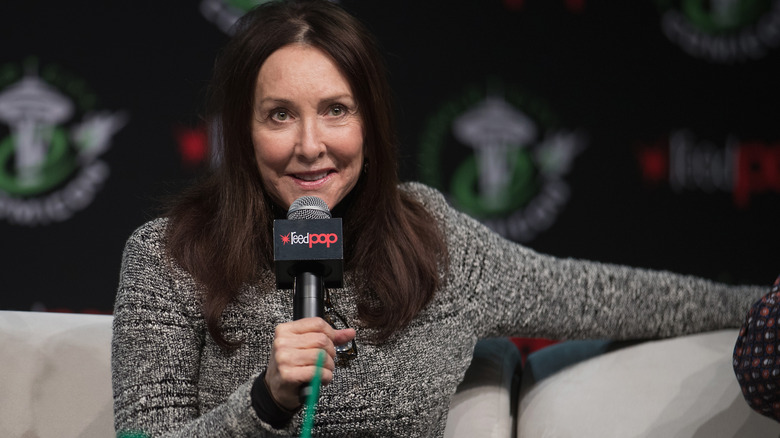 Tress MacNeille speaking into microphone