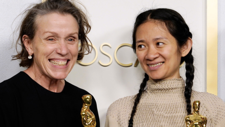 Frances McDormand and Chloé Zhao holding their respective Oscars