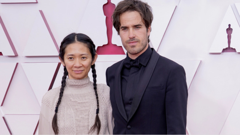 Chloé Zhao with Joshua James Richards at the 2021 Oscars