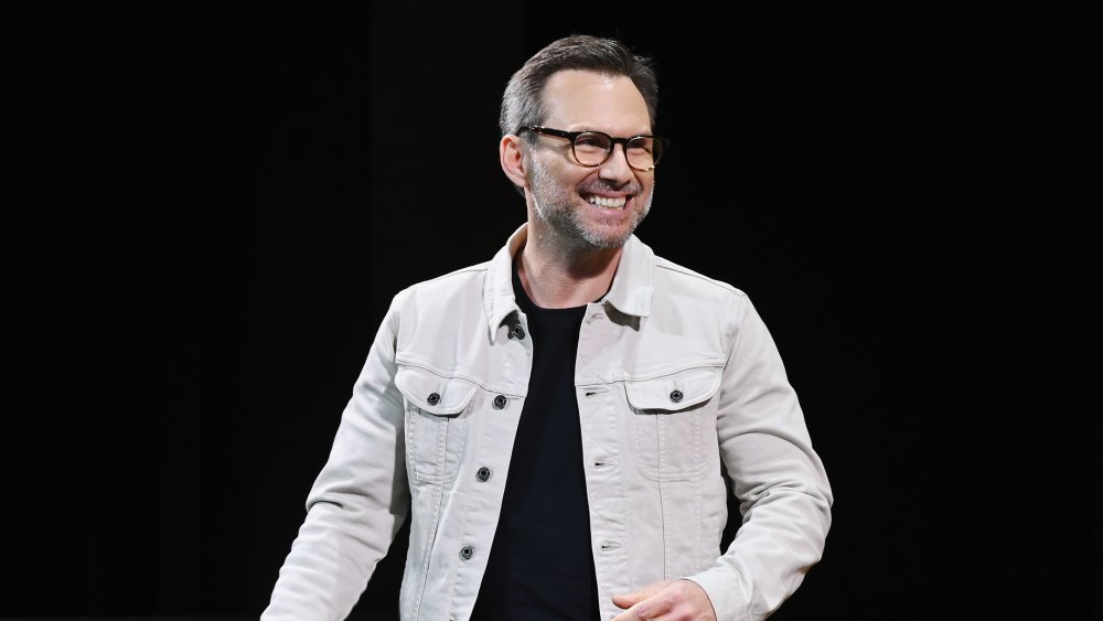 Christian Slater grinning