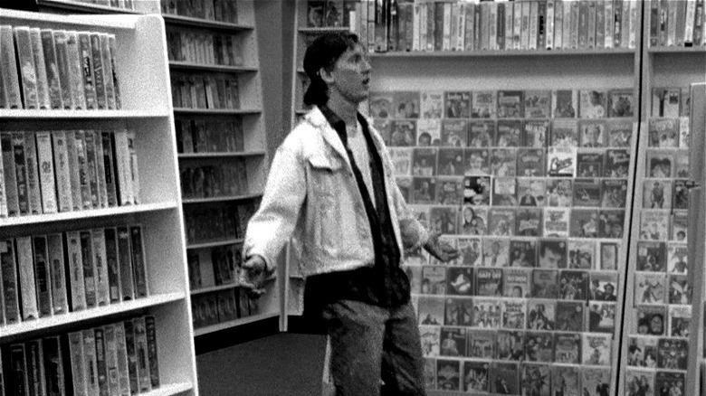 anderson surrounded by video shelves