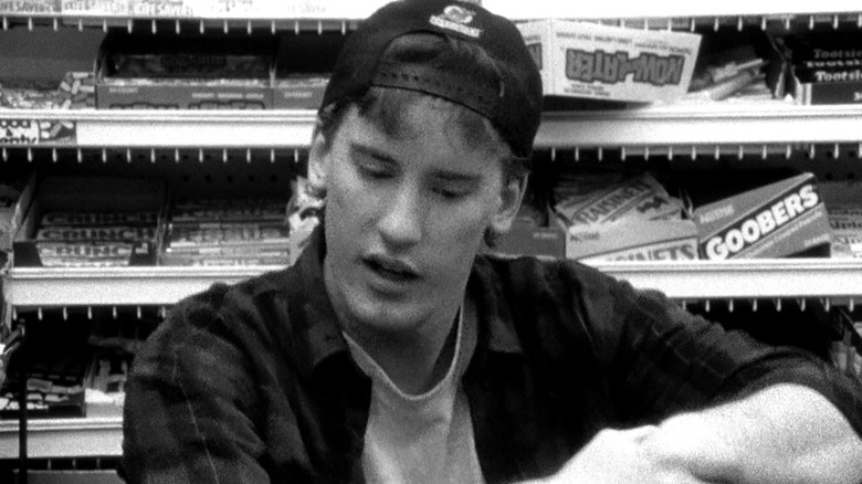 randal in front of candy shelf b&w