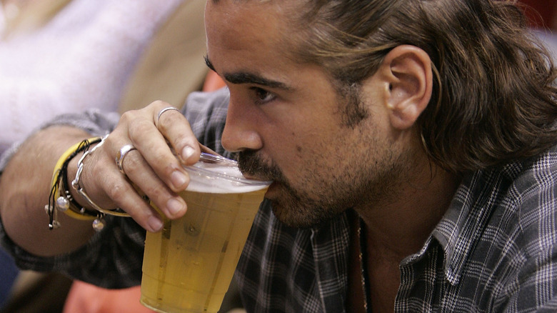 Colin Farrell drinking beer