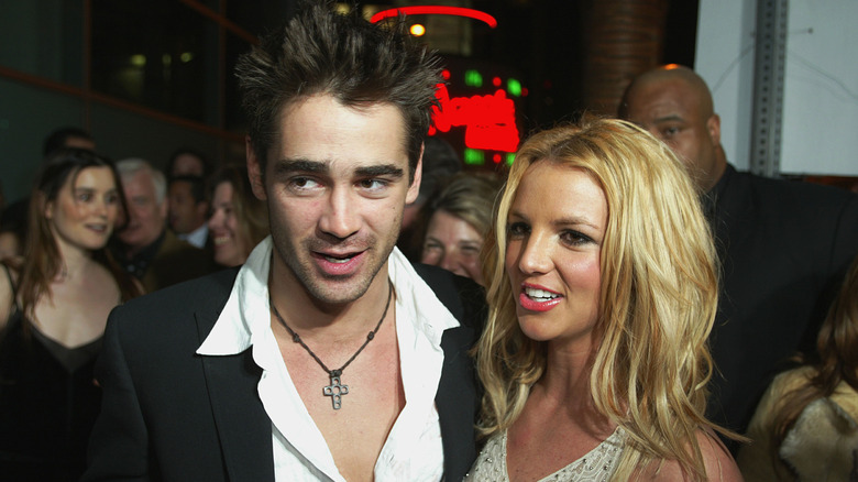 Colin Farrell stands with Britney Spears