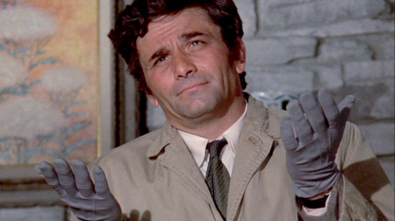 Columbo holding up gloved hands