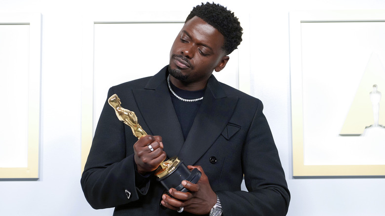 Daniel Kaluuya proudly holds Oscar