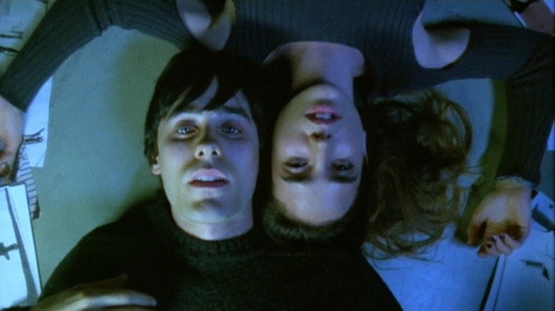 Harry and Marion laying on ground together