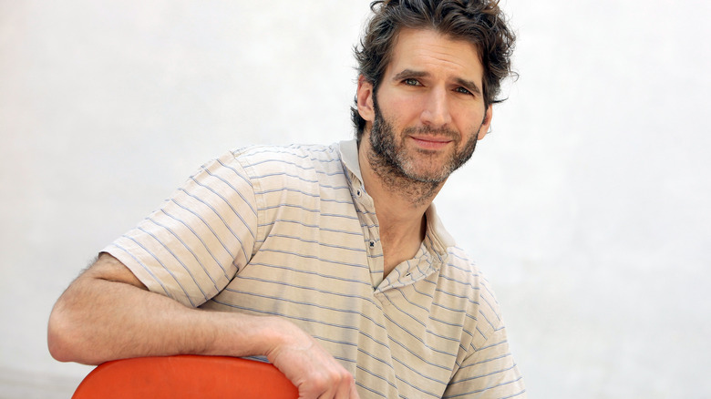 David Benioff leans on chair