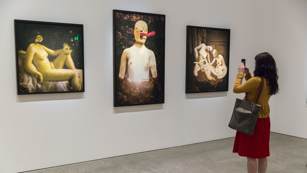 Woman viewing David Lynch's paintings