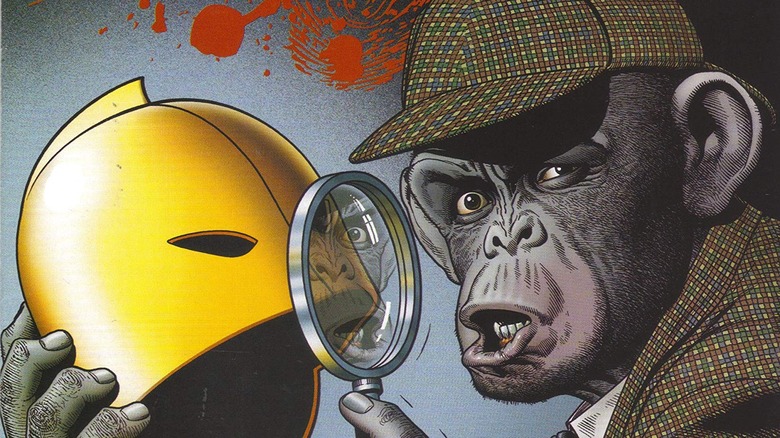 Detective Chimp examining helmet