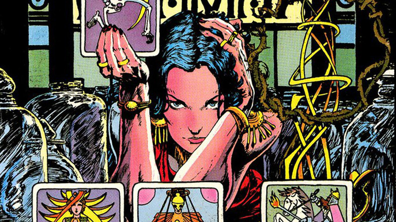 Madame Xanadu holding tarot cards