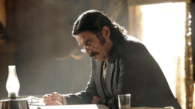 Al Swearengen reading a ledger