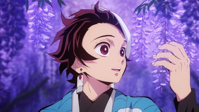 Tanjiro Kamado holding wisteria flowers