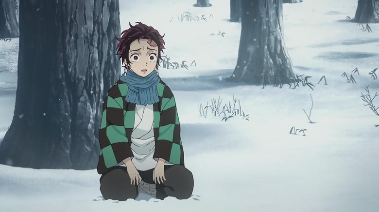 Tanjiro Kamado kneeling in snow